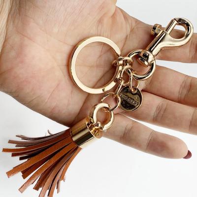 China Custom Leather Tassel Leather Metal Key Chain, Metal Hook Buckle Hanging Gift. Factory supplies made exquisite promotional gift keychains for sale