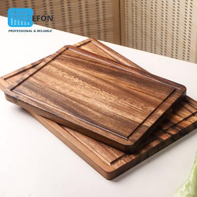 China Sustainable Household Acacia Wood Chopper Wooden Kitchen Chopper With Notched Handle Chopper Steak Dish for sale