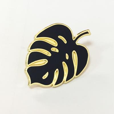 China Black Soft Collection Black Cartoon Brooch Shape Leaf Shape Europe Logo Pin White And Metal Lapel Badge Enamel for sale