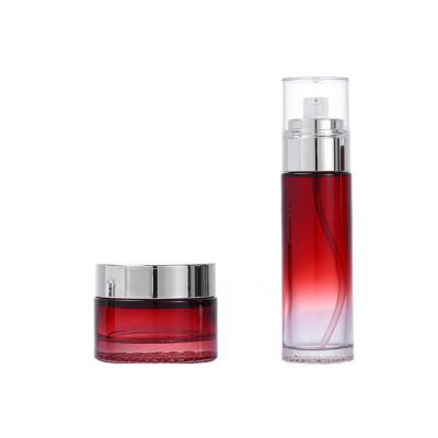 China Hot Sale Red Color Cosmetic Lotion Bottle Set Custom Face Cream Container Luxury Cosmetic Emulsion Bottle Glass Bottles for sale