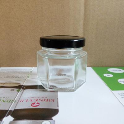 China Wholesale Hexagonal Clear Transparent Glass Canister Mini Food Jar 60ml Jam Jar Honey Pickles Bottle With Screw Lid for sale