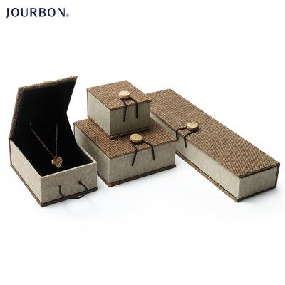 China Jourbon Microfiber Canvas Cover Button Jewelry Wooden Packaging Box With Wooden Buckle for sale