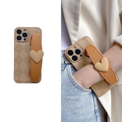 China Plaid 3D Pattern Love Heart Two Color Shockproof Hand Strap For iPhone 11 12 Cell Phone Case Cross-body Cover For iPhone 14 Pro Max for sale