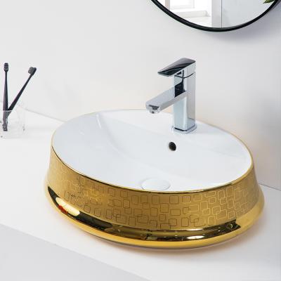 China Wholesale Modern Oval Ceramic Vessel Sink Top Table Art Hand Lavatory White Gold Luxury Sink For Bathroom for sale