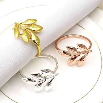 China Stocked Wedding Decoration Dining Room Use Metal Round Stainless Steel Gold Table Leaf Napkin Rings for sale