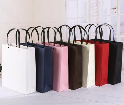 China Wholesale Recyclable Custom Packaging Paper Gift Bags With Handles Boutique Rivet Metal Button Luxury Paper Shopping Bag With Logo Print for sale