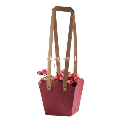 China Handmade Flat Design Handle Kraft Paper Packaging Bag Pure Color Paper Bag For Flower Packaging for sale