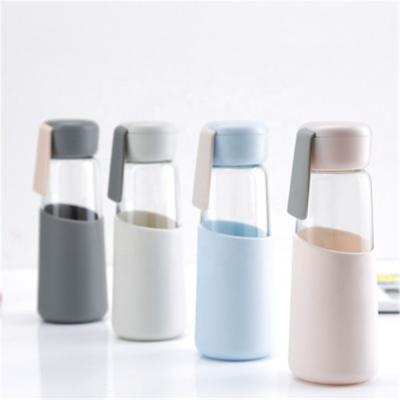 China Viable Natural Quartz Gemstone Glass Drinking Water Bottle With Silicone Sleeve Borosilicate Glass Water Bottle for sale