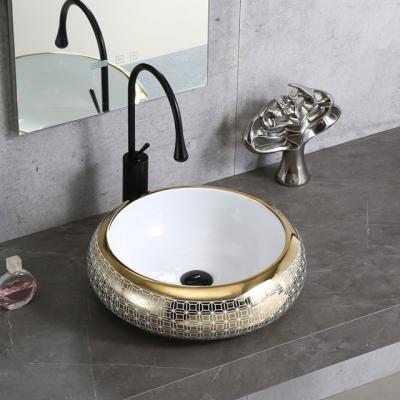 China Popular Bathroom Luxury Modern Ceramic Countertop Round Electroplate Hand Wash Sink No Hole Art Ceramic Wash Basin for sale