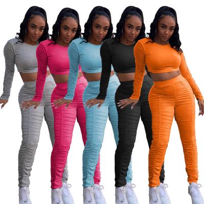 China Wholesale anti-static solid color sexy round neck clothing long sleeve pleated clothing 2021 drop women's two-piece set sports for sale