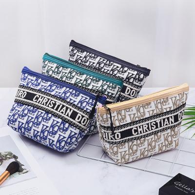 China Factory Wholesale Fashion Makeup Bag Waterproof Portable Lightweight Storage Letter Cosmetic Bag for sale