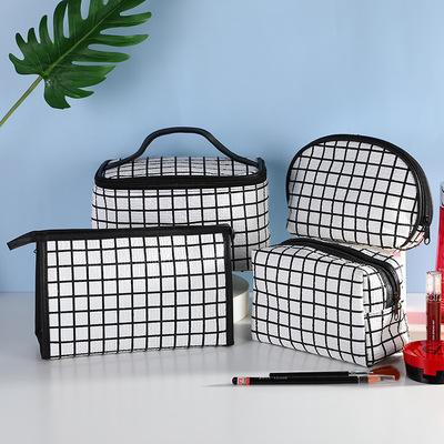 China Large Capacity Customized Pocket Cosmetic Travel Makeup Set Lattice PU Bag Cosmetic Bags And Cases for sale