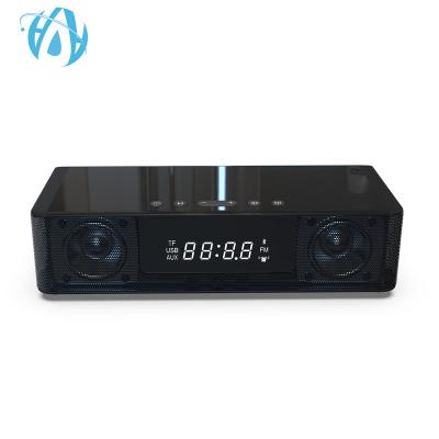 China Mini Wireless Charger Speaker Power Bank FM Radio Alarm Clock 10W Bluetooth Speaker For Phone for sale