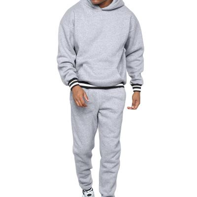 China Anti-wrinkle men's sweater set contrast color splice sweater men's sports two-piece hooded casual suit for sale