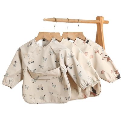 China Viable Danish Children's Long Sleeve PU Reverse Clothing Baby Eating Meal Super Soft Waterproof Bib Pocket Anti-dirty Baby Jumpsuit for sale