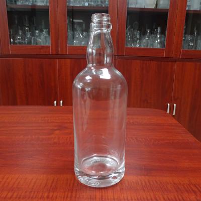 China 70cl Fancy Empty Glass Beverage Bottle For Vodka 700ML Round Whiskey Bottle for sale