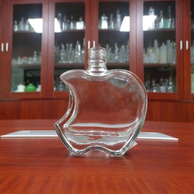 China Personal Care Super Flint Perfume Bottle 100ML Glass Perfume Bottle In Apple Shape for sale