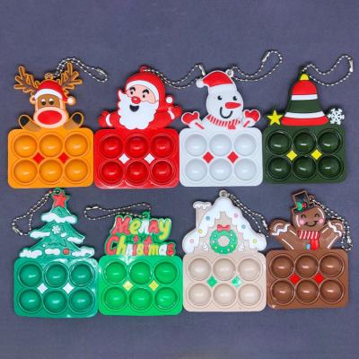 China New PVC Decompression Cartoon Christmas Pendant Squeeze Bubble Decoration Key Chain for sale