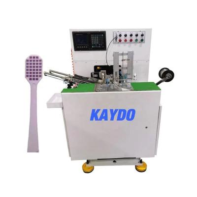 China Toothbrush customized 3 axis toothbrush tucking machine with trim main high production with 2 or 3 color boxes can make hot sale brus for sale