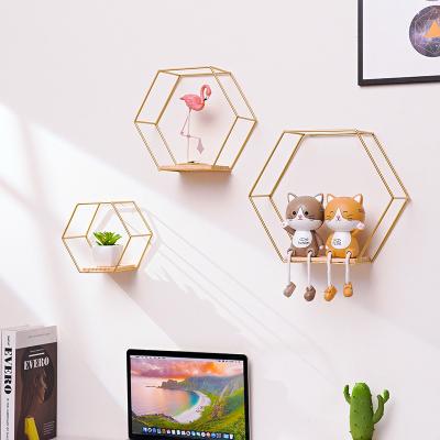 China Floating Storage Shelves Black Gold Hexagonal Wrought Iron Wall Hanging Storage Wall Shelf Wall Decor For Living Room Hanging Decoration for sale