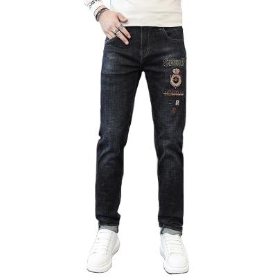 China 2021 new fashionable European fashionable youth badges brand embroidery thin slim black pants station jeans for men for sale