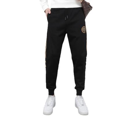 China 2021 new autumn/winter slim anti-static stretch knit casual pants fashion print men's flowered foot sweatpants for sale