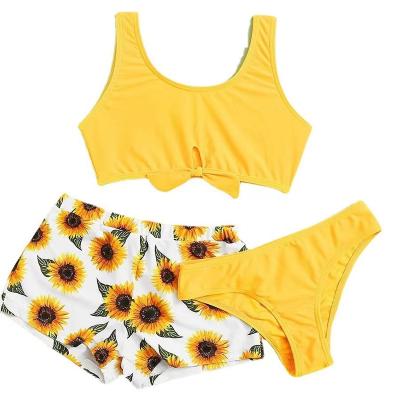 China Triangle Girls Twist Trim Bikini Swimsuit with Floral Beach Shorts for sale