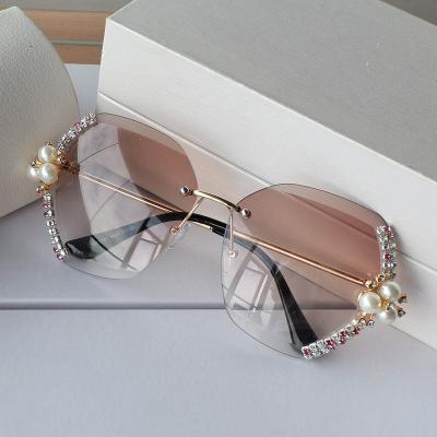 China 2020 fashion sunglasses shape women rimless rhinestone pearl luxury sunglasses for sale