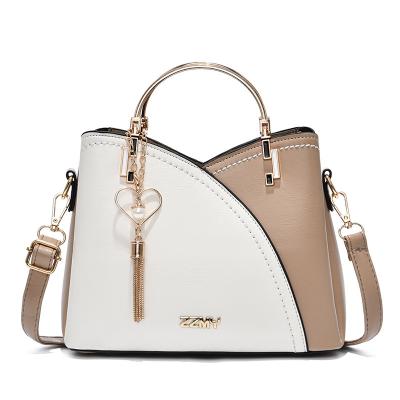 China Hot selling fashion luxury trends of the latest high quality metal tassel designer brand wholesale fashion packaging women large shoulder leather handbag for sale