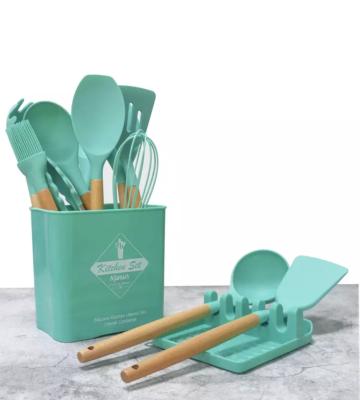 China Sustainable Hot Selling 13 Pieces Silicone Kitchen Cookware Set With Wooden Handle for sale