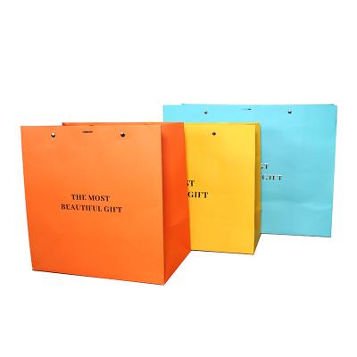 China Recycled Materials Custom Colored Paper Bag Fashion Specialty Gift Packaging Offset Shopping Printing Paper Bags for sale