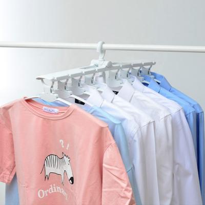 China Eco-friendly Multi-function Folding Magic Adjustable Cloth Hanger Plastic Hanger for sale