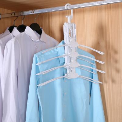 China Eco-friendly Hanger Folding Cloth Hanger Garment Baby Kids Plastic Cloth Hanger for sale