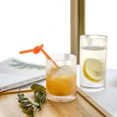 China Hot Sale Mouthblown Amazon Stripe Embossed Pattern Whiskey Clear Champagne Highball Dof Glass Cup Cocktail for sale