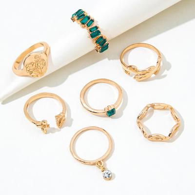 China Women Customized 7 Pieces Gold Plated Ring Set With Green Crystal Butterfly Rose Shaped Rings Hand Trendy Jewelry for sale