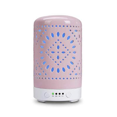 China Ceramic Hollow Aroma Diffuser Air Humidifier Bedroom Hotel Rose Pattern Ultrasonic Perfume Oil Diffuser for sale