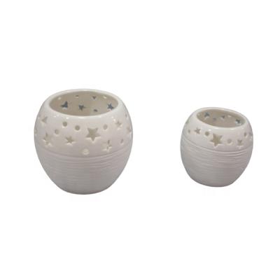 China Home decoration snowflake punched candle cut out tealight holder white ceramic hanging candle holders for sale