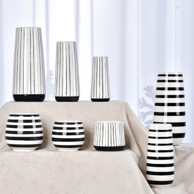 China Wholesale Minimalist High Grade Round Bottom White Ceramic Vase With Black Lines Pillar Shape Flower Vase for sale