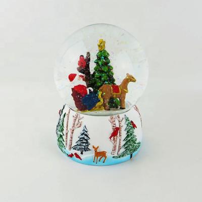 China Artificial Christmas Snow Globe Water Snowglobe With Rich Resin Base And Xmas Scene for sale