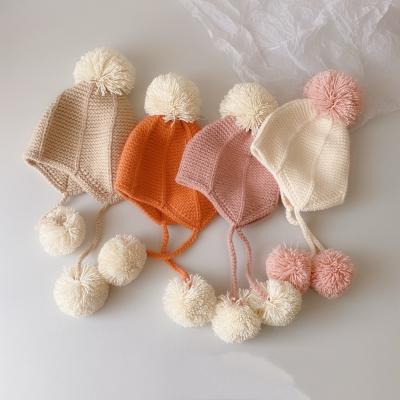 China 2021 New COMMON Newborn Winter Kids Hat Para Gorros Babies Fashionable Newborn Earflap Hair Ball Hat For Boys for sale