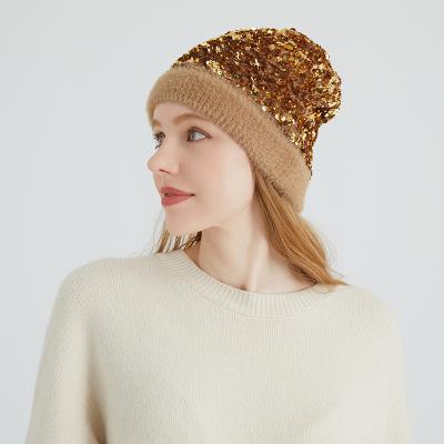 China Fashion JOINT Sequin Women Winter Shiny Hats With Fur Pom Pom for sale