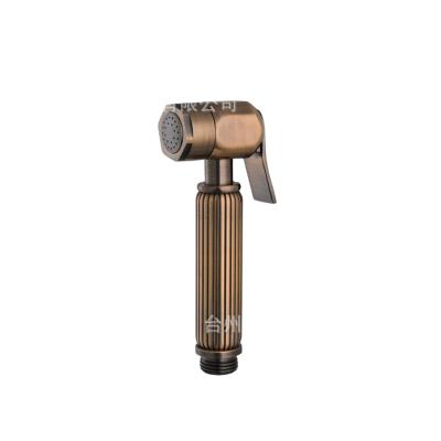 China Sefl-cleaning quality copper Nice gold shiny bidet brass handheld sprayer for sale