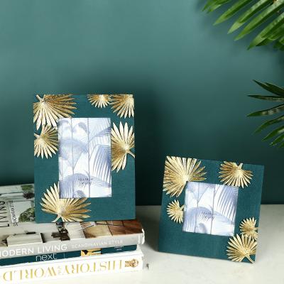 China Handmade custom decorative line palm photo frame polyresin picture fabric frame for sale