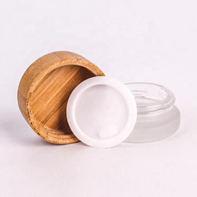 China Wholesale 30/50/100g Glass Cosmetic Empty Cosmetic Cream Jars With Bamboo Lids Customize Frosted Glass Packaging Cosmetic Jars for sale