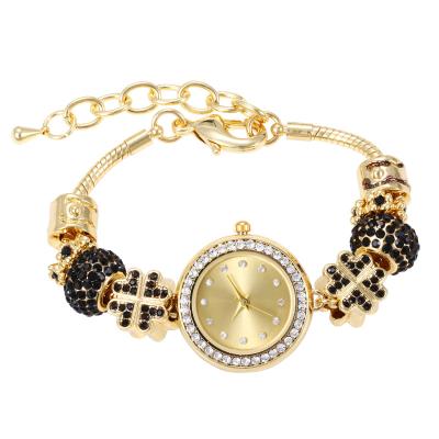 China Popular Chronograph Design Charm Ceramic Beaded Luxurious Elegant Gold Color Ladies Wrist Watch Strap Quartz Watch For Women for sale