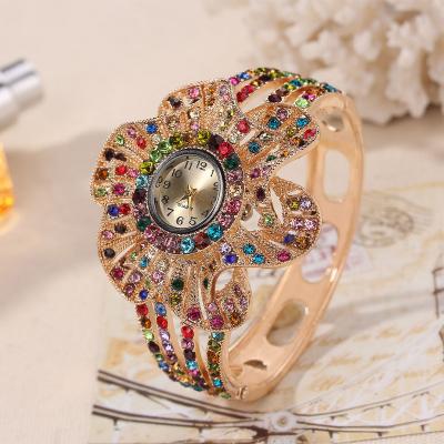 China Trendy Mixed Color Diamond Nigerian Bridal Chronograph Bracelet Watch For Women Flower Shape Quartz Watch For Ladies Wedding Jewelry for sale