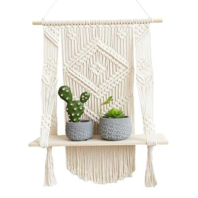 China 2021 Macrame Plant Hanger Customized Macrame Wall Hanging Shelf Boho Rope Plant Hanger Artificial Pot Rack For Wall Decoration for sale