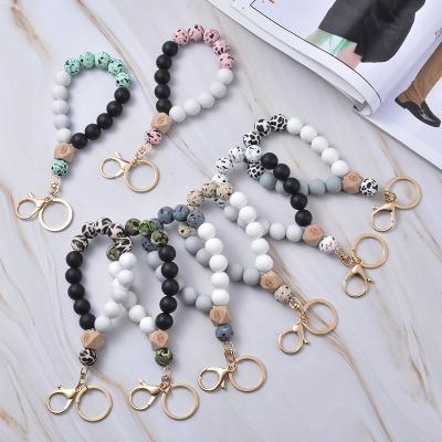 China Hot Selling SILICONE Designs Silicone Beaded Key Chain Bracelet Bangle Bracelet Keychain For Women for sale