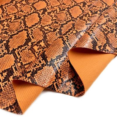 China Elastic (FA-426) 0.5 Mm Foiled Snakeskin Fabric PU Leather Glitter For Bags And Shoes for sale