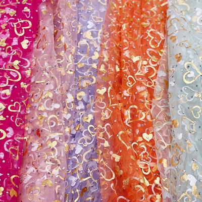 China 100% Metallic Polyester Mesh Mesh Tulle Fabric Diamond Printing Gold Foil Wedding Dress Textile DIY Love Toy For Garment for sale